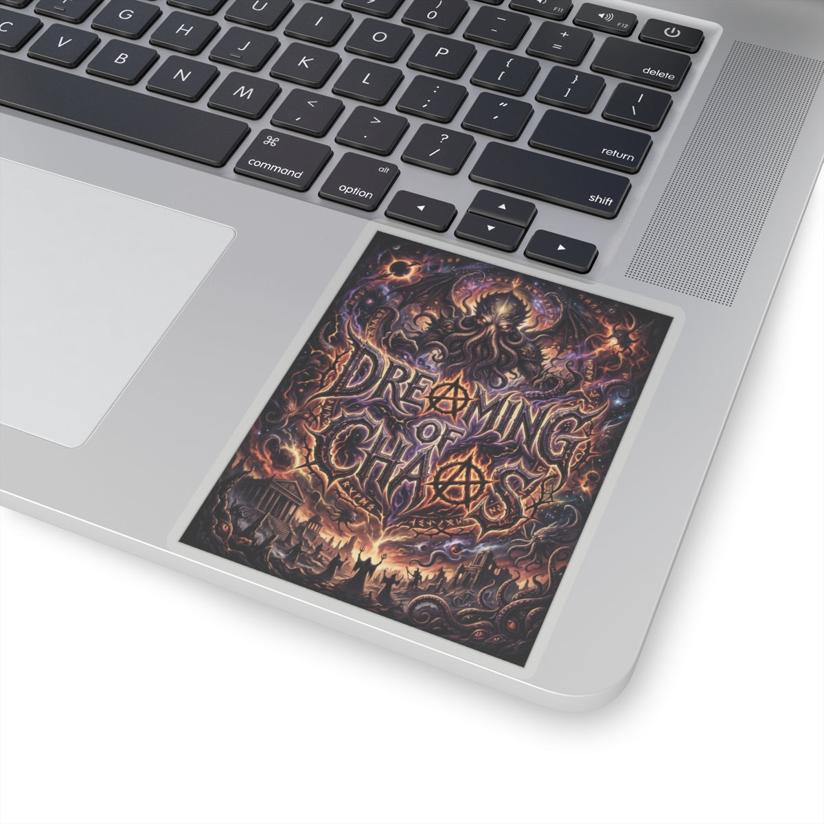 Dreaming of Chaos kiss-cut sticker on a laptop — transparent finish, 4″ × 4″