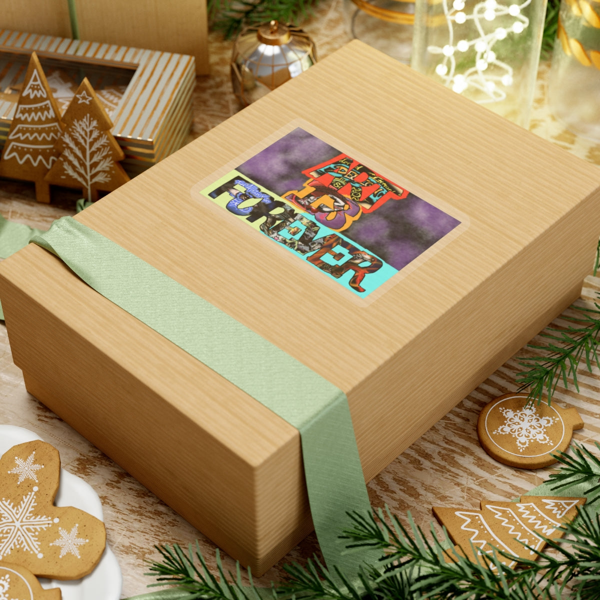 Art Is Forever kiss-cut sticker on a gift box — transparent finish, 4″ × 4″