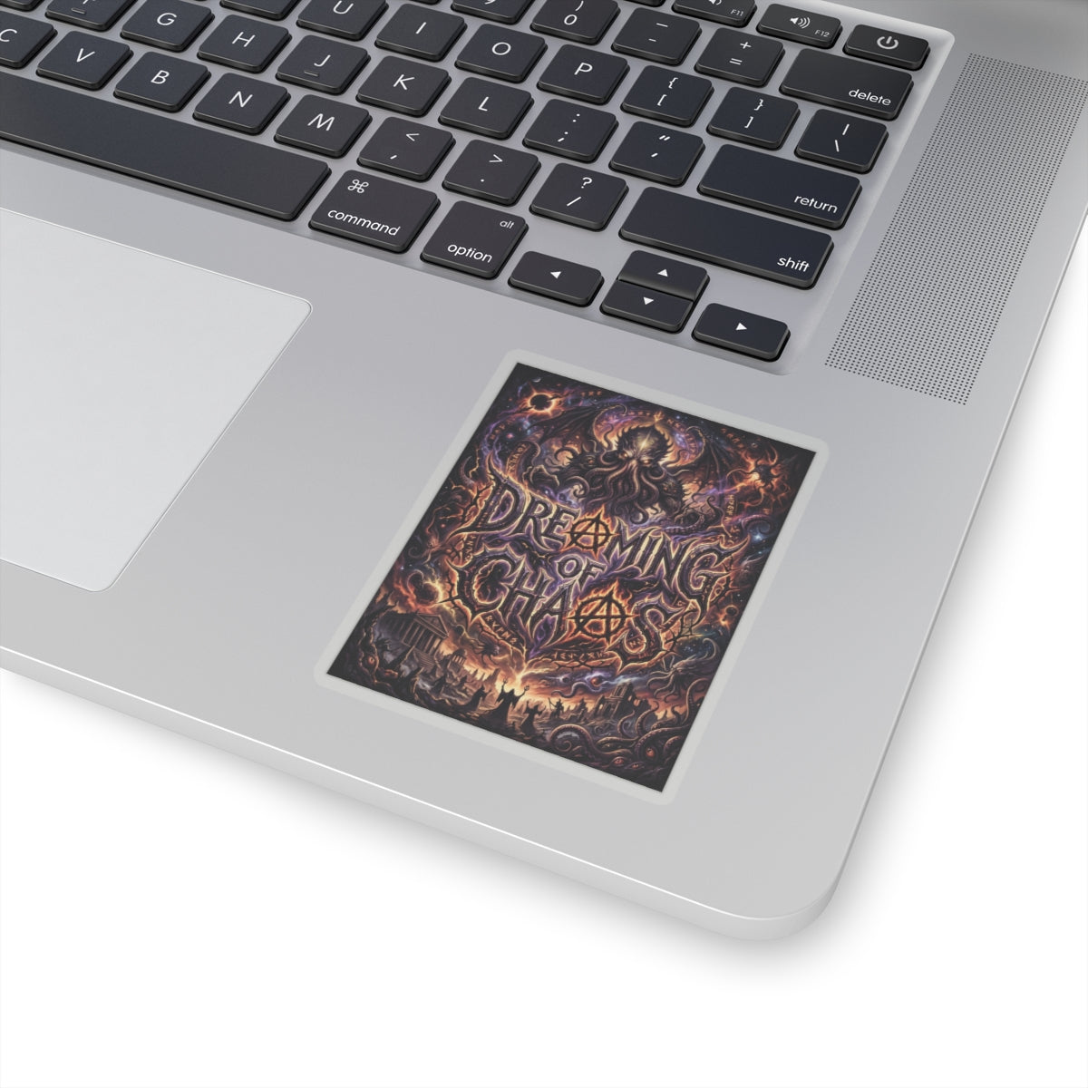 Dreaming of Chaos kiss-cut sticker on a laptop — transparent finish, 3″ × 3″