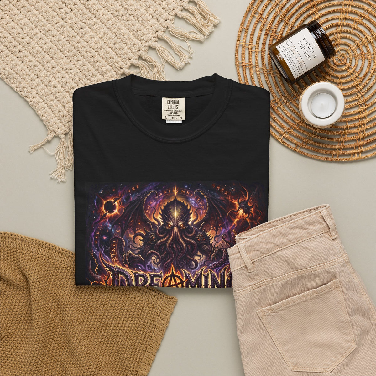 Dreaming of Chaos heavyweight tee — black, flat lay styled with props