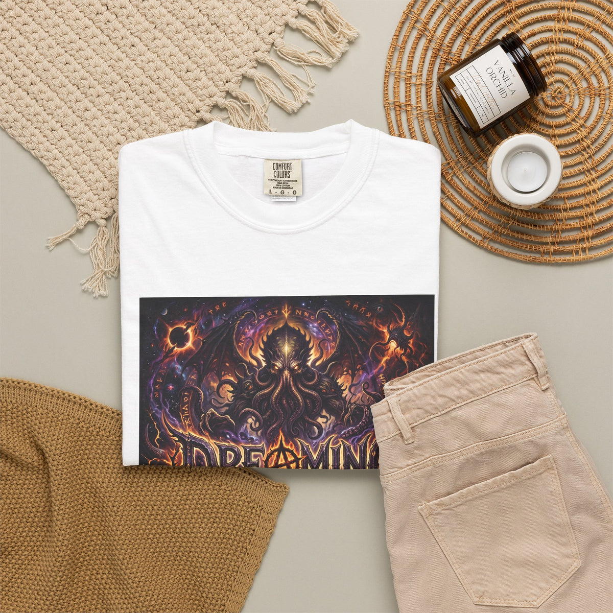 Dreaming of Chaos heavyweight tee — white, flat lay styled with props
